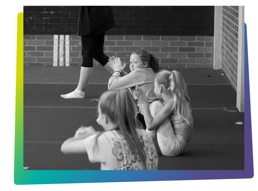 Cheerleading tumbling classes Cheshunt - Girls at class sitting on matt